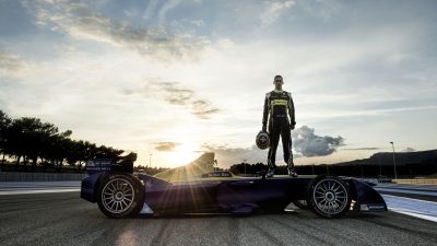 Sebastian Vettel standing on the Renault Car